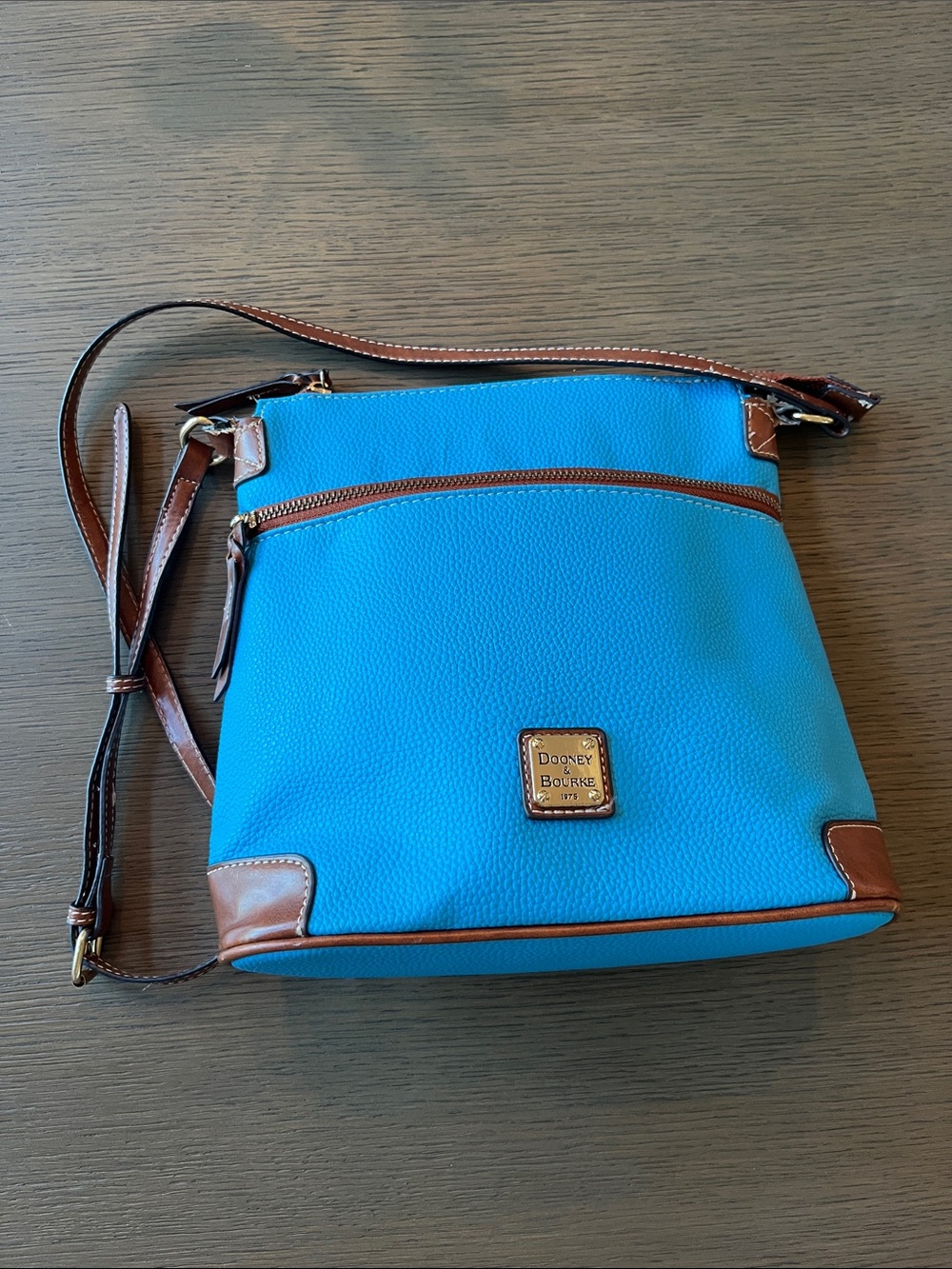 Dooney & Bourke Turquoise Crossbody with Brown Trim and Logo Plaque